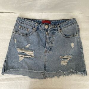Distressed blue denim mini skirt